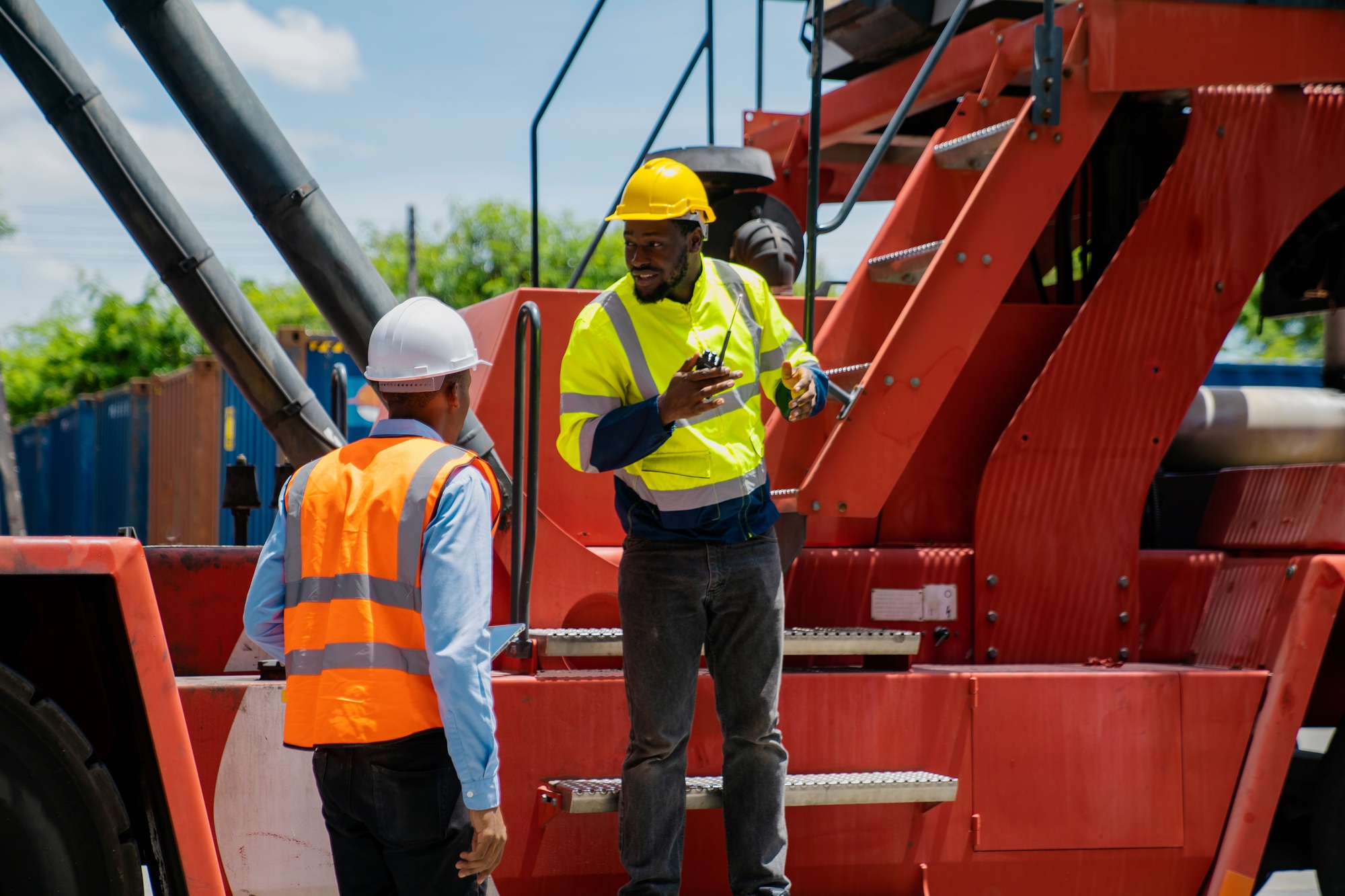 African American working engineer foreman explaining the step-by-step process.